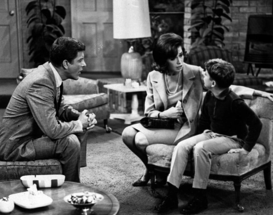 FILE - In this 1965 file photo, Dick Van Dyke, left, and Mary Tyler Moore talk to Larry Matthews, who plays their son, on "The Dick Van Dyke Show." Van Dyke is the recipient of the Life Achievement Award at the upcoming 19th Annual SAG Awards ceremony on Sunday, Jan. 27, 2013. (AP Photo, File)