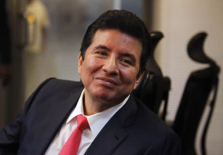 Alejandro Moncada Luna smiles while appearing in front of a congressional committee in Panama City October 20, 2014. REUTERS/Stringer