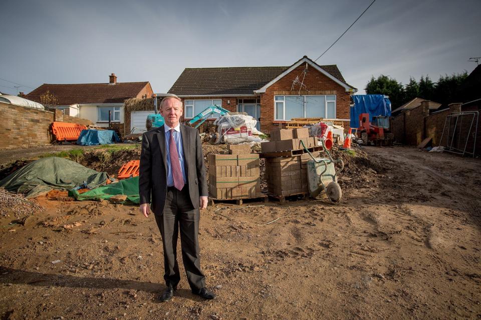 Graham Wildin, from the Forest of Dean, outside his home where he built a 'man cave' in the back garden. See SWNS story SWBRcave; A man ordered to knock down 'Britain's best man cave' which he built illegally in his back garden has been told to pay £30,000 to the council to cover its prosecution costs. Graham Wildin, 66, spent four years battling with authorities over the private leisure complex. It contains a bowling alley, cinema, casino and a gym - and pictures from Google Earth show it looking like a massive factory. But a High Court judge said the granddad-of-five must comply with the council and remove the centre.