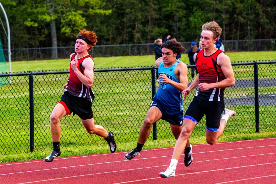 Old Rochester's Colby Gross and Remy Wilson compete in the 200 dash at the SCC Championship.