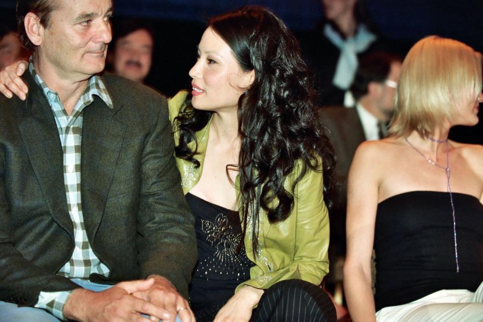 lucy liu with her arm around bill murray's shoulder