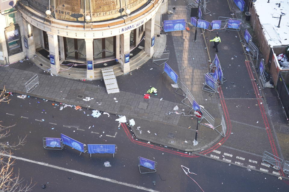 The scene outside Brixton O2 Academy where police are investigating the circumstances which led to four people sustaining critical injuries in an apparent crush as a large crowd tried to force their way into the south London concert venue, Friday Dec. 16, 2022. Four people were hospitalized in critical condition on Friday after a suspected crush at a London concert venue, where Nigerian singer Asake was performing. (James Manning/PA via AP)