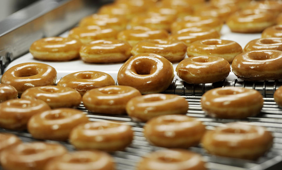 You may need several friends to help you finish a dozen free donuts! Getty Images