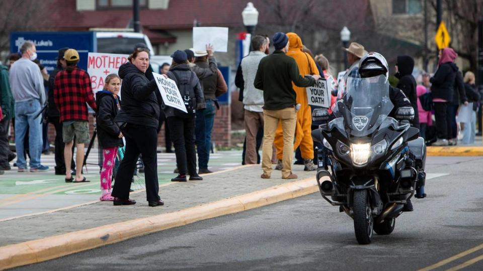 Protesters gather outside the St. Luke’s hospital in downtown Boise in March 2022, causing the medical campus to go into security lockdown.