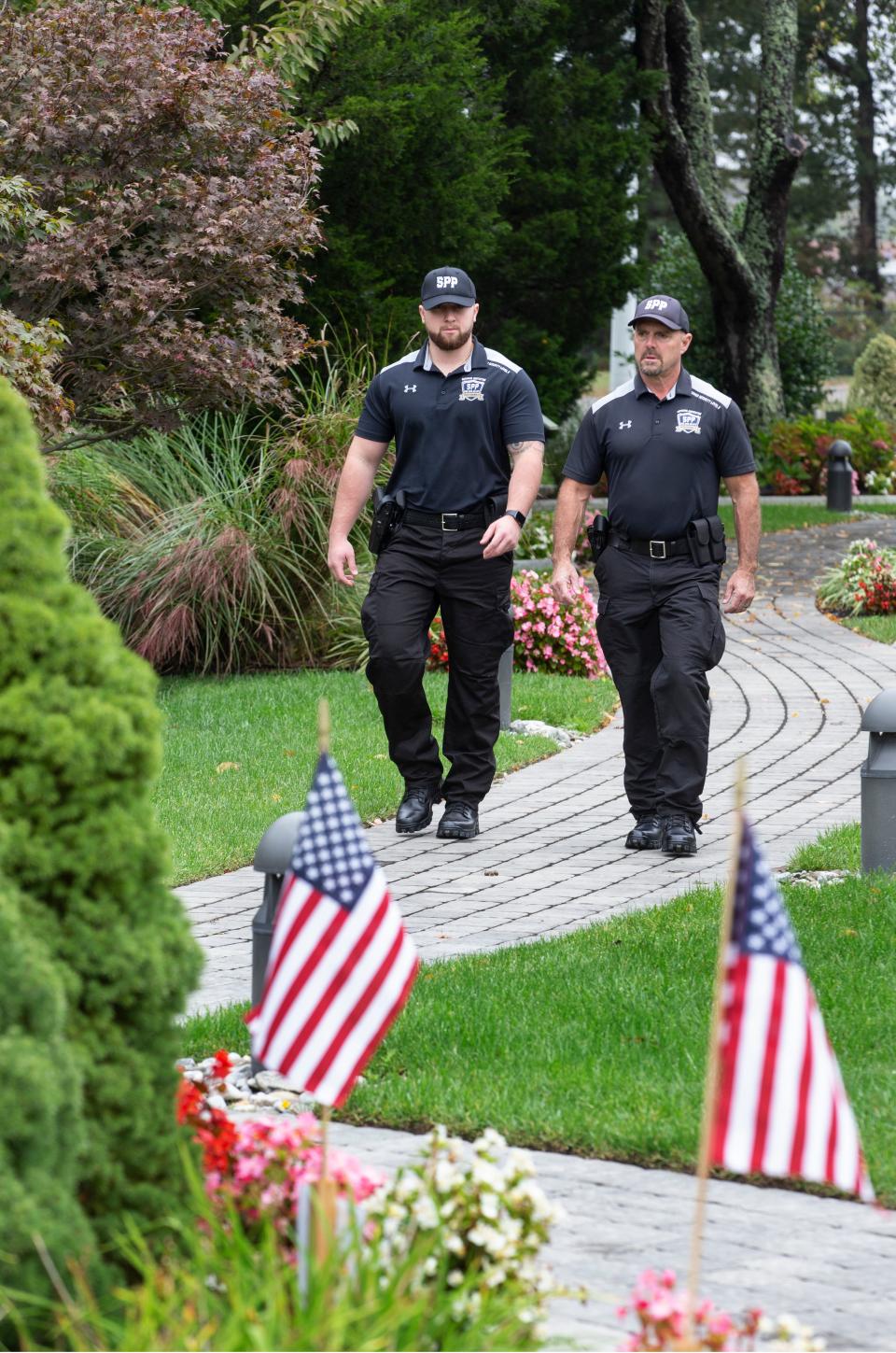 Superior Protection Professionals is a year-old Toms River-based company which consists of a team of retired police officers who provide security services to events and locations. Business owner Kelly Conklin stands with his son Kelly Conklin Jr. at the Toms River War Memorial. Toms River, NJTuesday, October 13, 2020  