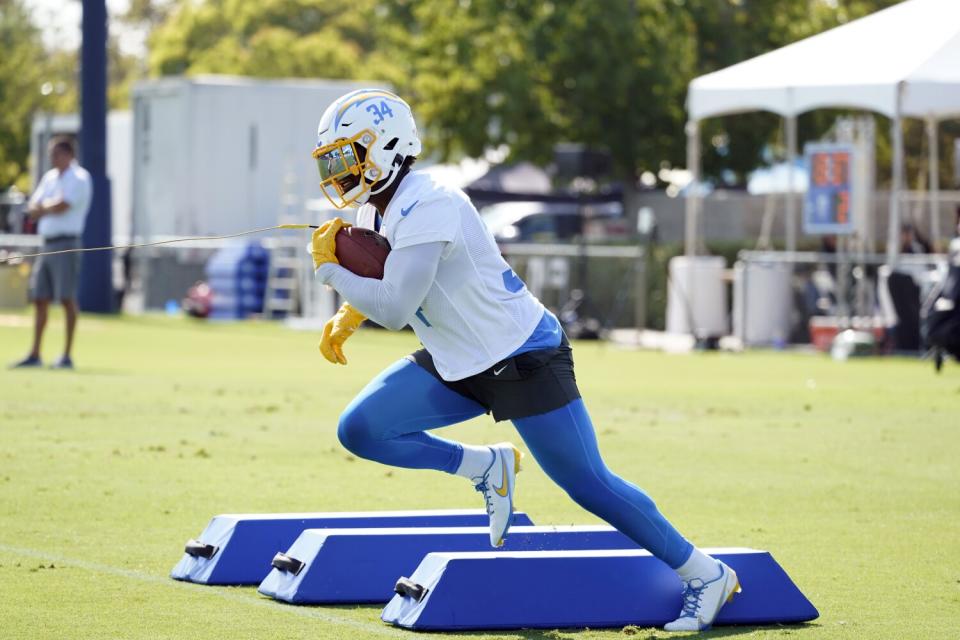 Chargers running back Larry Rountree III runs a drill at camp.