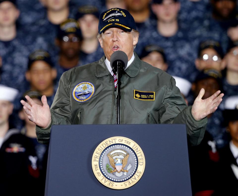 In this March 2, 2017, photo, President Donald Trump gestures as he speaks to Navy and shipyard personnel aboard nuclear aircraft carrier Gerald R. Ford at Newport News Shipbuilding in Newport News, Va. Facing a new wave of questions about his ties to Russia, Trump is telling advisers and allies that he may abandon, at least temporarily, his plan to pursue a deal with Moscow on the Islamic State group and other national security matters, according to administration officials and a Western diplomat. (AP Photo/Steve Helber)