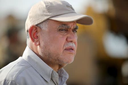 Head of the Badr Organisation and Shi'ite paramilitary commander Hadi al-Amiri follow up military plans in al Nibaie, in Anbar province May 26, 2015. REUTERS/Stringer