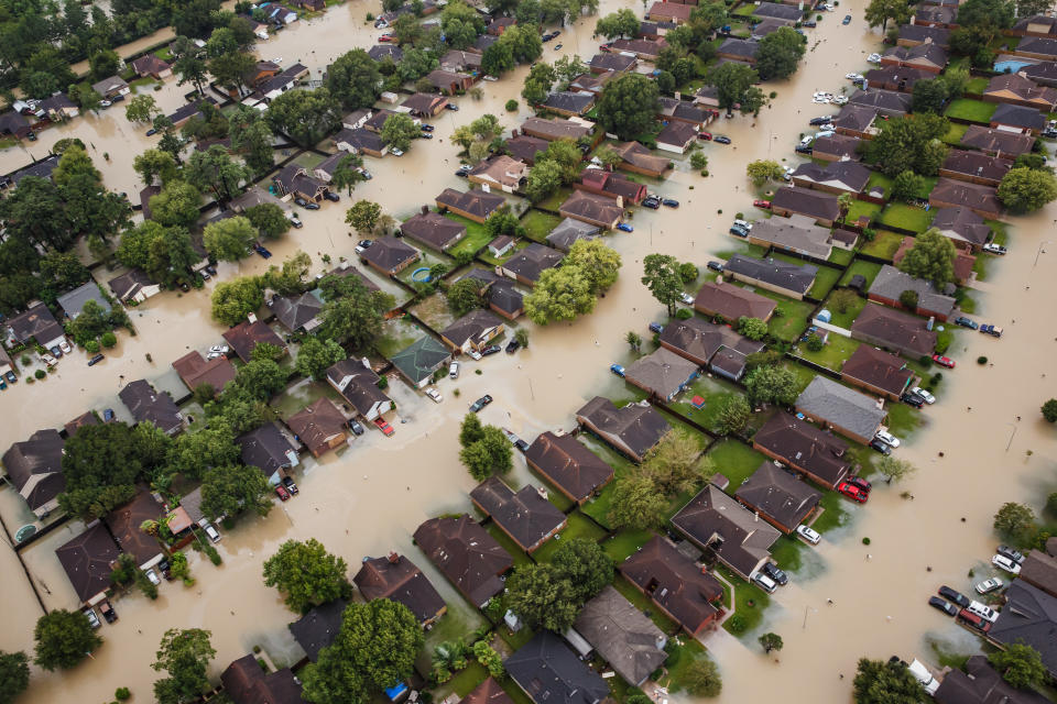 <p>Residential neighborhoods near the Interstate 10 sit in floodwater in the wake of Hurricane Harvey on August 29, 2017 in Houston, Texas. (Photo: Marcus Yam / Los Angeles Times via Getty Images) </p>