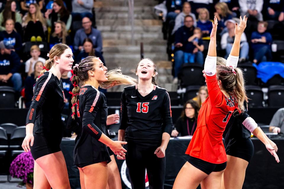 Davenport Assumption players celebrate a point during their win over Des Moines Christian in the Class 3A state quarterfinals on Tuesday.
