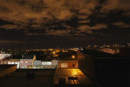 New York Police Department lights illuminate Maujer Street and the scene of a multiple shooting crime scene in the Brooklyn borough of New York, November 11, 2013. REUTERS/Lucas Jackson