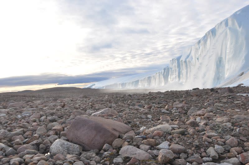 Scientists perform research field work at the edge of the Greenland Ice Sheet