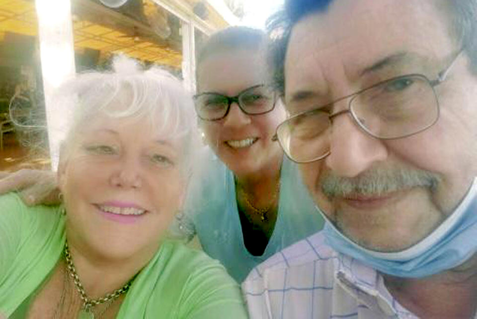 Raysa Rodriguez, center, with her neighbors Dick Augustine and Elaine Sabino, who lived in apartment 1210 and are still unaccounted for. (The Moskowitz Law Firm)