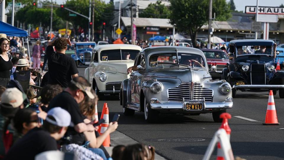 Classic car owners cruise down McHenry Avenue during the Graffiti Parade in Modesto, Calif., Friday, June 9, 2023. Andy Alfaro/aalfaro@modbee.com