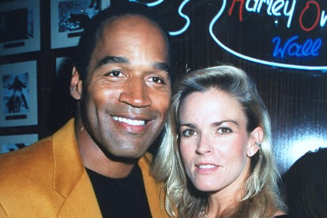 <p>Robin Platzer/Getty</p> O.J. Simpson and Nicole Brown Simpson e at the opening of the Harley Davidson Cafe.