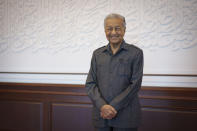 Malaysia's former Prime Minister Mahathir Mohamad poses for a picture during an interview with The Associated Press at his office in Kuala Lumpur, Malaysia, Friday, Aug. 19, 2022. Mahathir expects Malaysia’s graft-tainted ruling party will hold general elections in coming months, and could win big, but the nonagenarian reformer vowed Friday that he would fight "even a losing battle" on principle. (AP Photo/Vincent Thian)