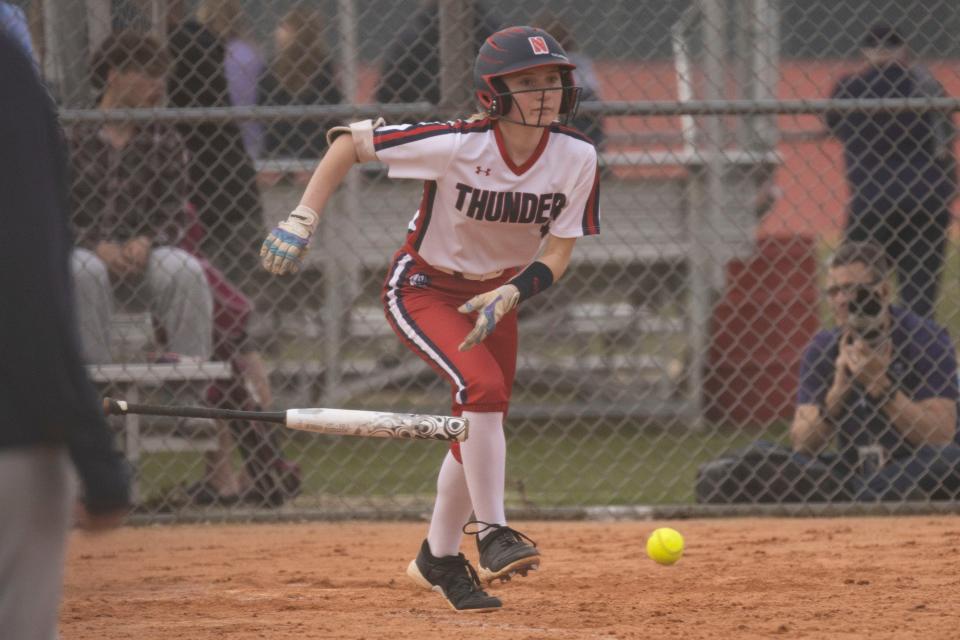 Belvedere North's Jenna Yakey (1) bunts the ball during a game against Rockford East on Wednesday, April 10, 2024 at Belvidere North High School.