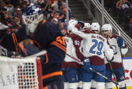 Colorado Avalanche players celebrate a goal against Edmonton Oilers goalie Mike Smith (41) during the first period of Game 3 of the NHL hockey Stanley Cup playoffs Western Conference finals, Saturday, June 4, 2022, in Edmonton, Alberta. (Jason Franson/The Canadian Press via AP)