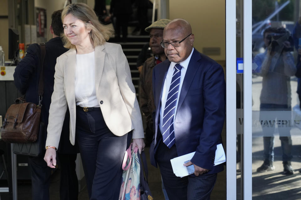 Papua New Guinea's sidelined Petroleum Minister Jimmy Maladina, right, leaves Waverley Local Court House in Sydney, Thursday, July 11, 2024. The 58-year-old Maladina appeared in the Waverley Local Court for the first time since he alleged assaulted a 31-year-old woman on Saturday at an address in nearby Bondi in Sydney's expensive eastern suburbs. (AP Photo/Rick Rycroft)