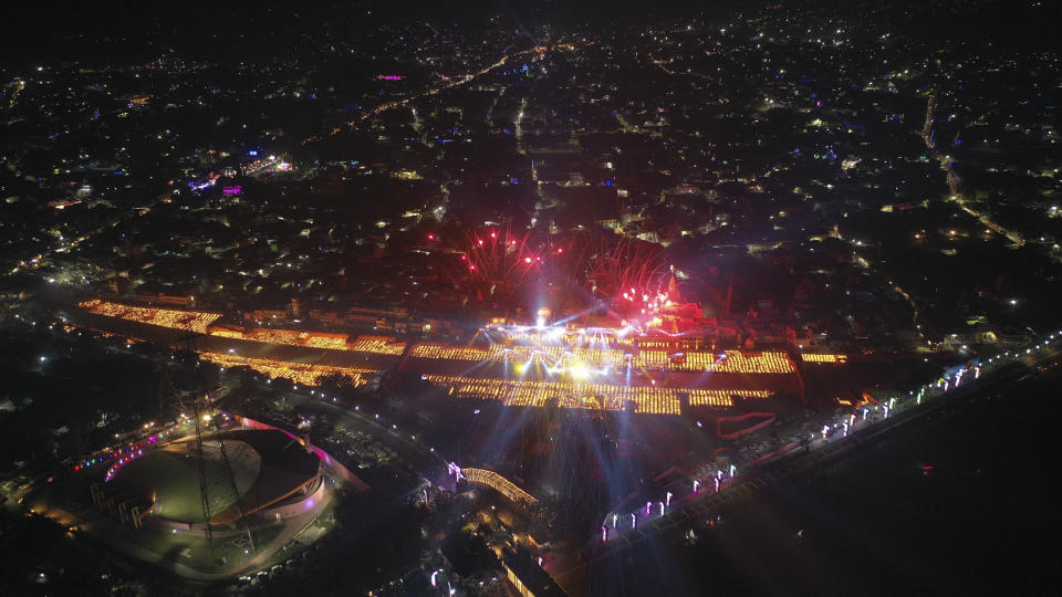 Lamps light up the banks of the river Saryu in Ayodhya, India, Wednesday, Nov. 3, 2021. Over 900,000 earthen lamps were lit and were kept burning for 45 minutes as the north Indian city of Ayodhya retained its Guinness World Record for lighting oil lamps as part of the Diwali celebration – the Hindu festival of lights. (AP Photo/Rajesh Kumar Singh)