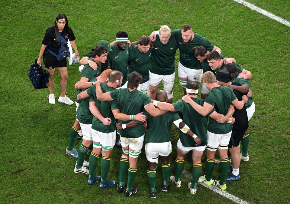 South African players have a team talk before kick-off (AFP via Getty Images)