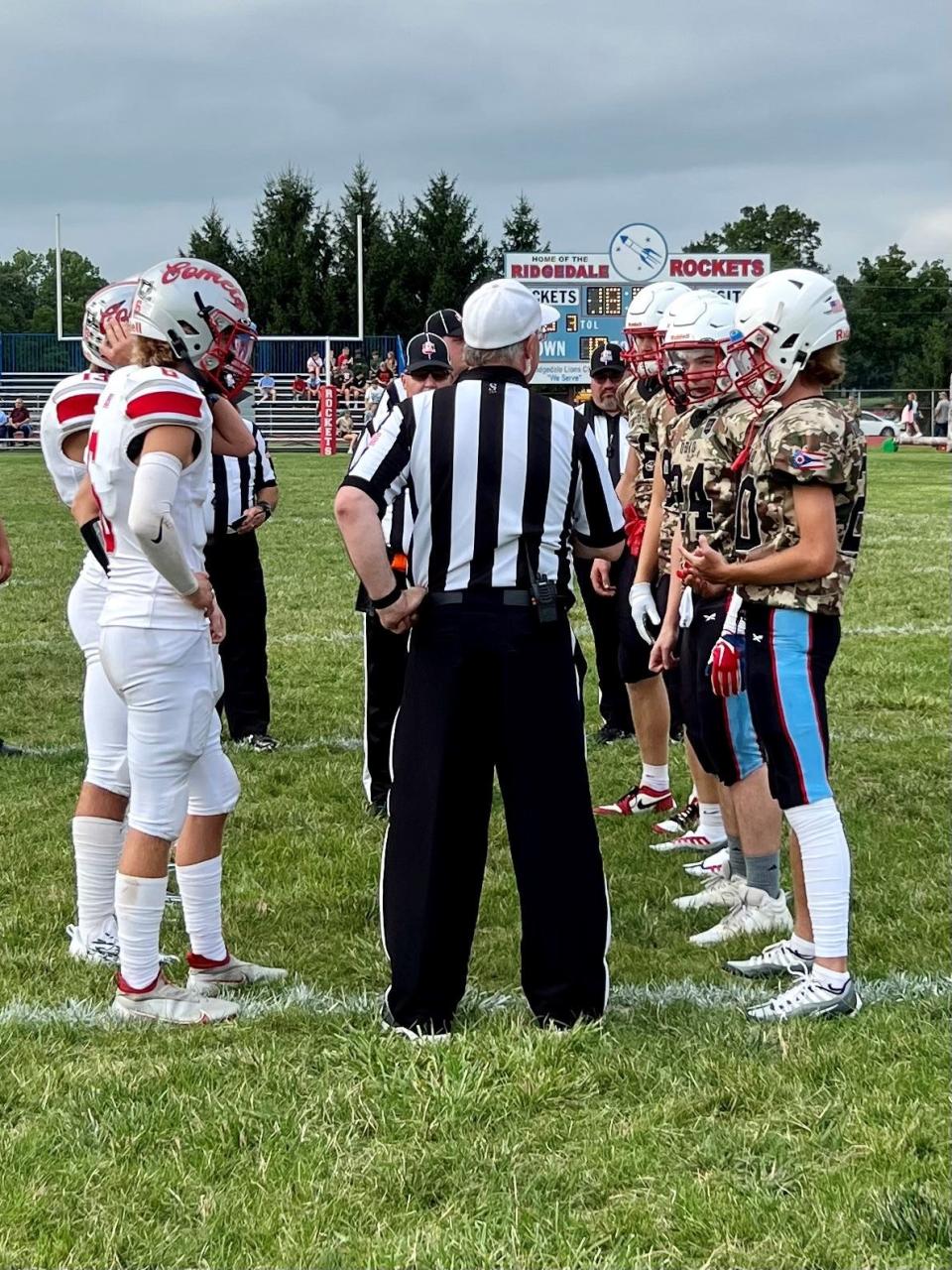 The Elgin and Ridgedale captains meet for the coin toss before their Week 2 football game at Ridgedale.