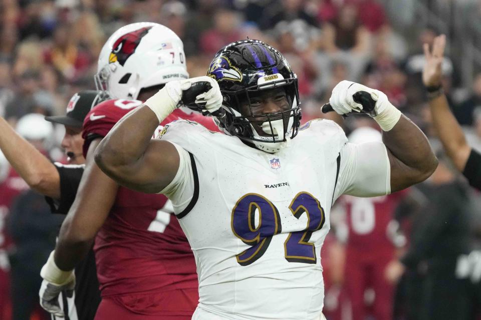 Baltimore Ravens defensive tackle Justin Madubuike (92) flexes his arms after sacking Arizona Cardinals quarterback Joshua Dobbs (9) during the second half of an NFL football game Sunday, Oct. 29, 2023, in Glendale, Ariz. (AP Photo/Rick Scuteri)