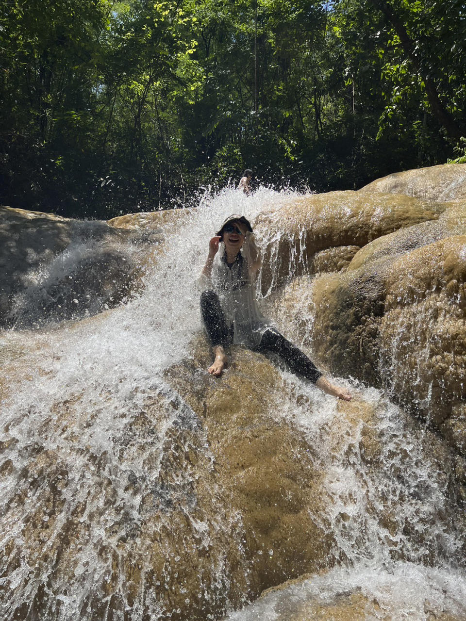 Chinese Chuannan Zhang, who is studying Thai in Chiang Mai, went hiking on the Chiang Dao mountain range in northern Thailand, June 2023. A growing number of young Chinese are moving overseas, frequently to Southeast Asia, to escape their homeland's ultra-competitive work culture, limited opportunities and family pressures. There is no exact data on the number of the moves, the popular Chinese social media platform Xiaohongshu, hundreds of people have discussed relocating to Thailand. (AP Photo/Syvia Wen )