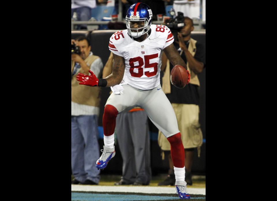 New York Giants wide receiver Martellus Bennett (85) celebrates after his touchdown catch against the Carolina Panthers during the first quarter of an NFL football game in Charlotte, N.C., Thursday, Sept. 20, 2012.