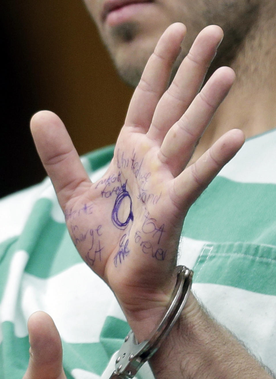 Anthony Comello's hand was covered in&nbsp;pro-Trump messages penned with blue ink. (Photo: ASSOCIATED PRESS)