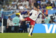 Poland's Robert Lewandowski controls the ball during the World Cup group C soccer match between Poland and Argentina at the Stadium 974 in Doha, Qatar, Wednesday, Nov. 30, 2022. (AP Photo/Darko Bandic)