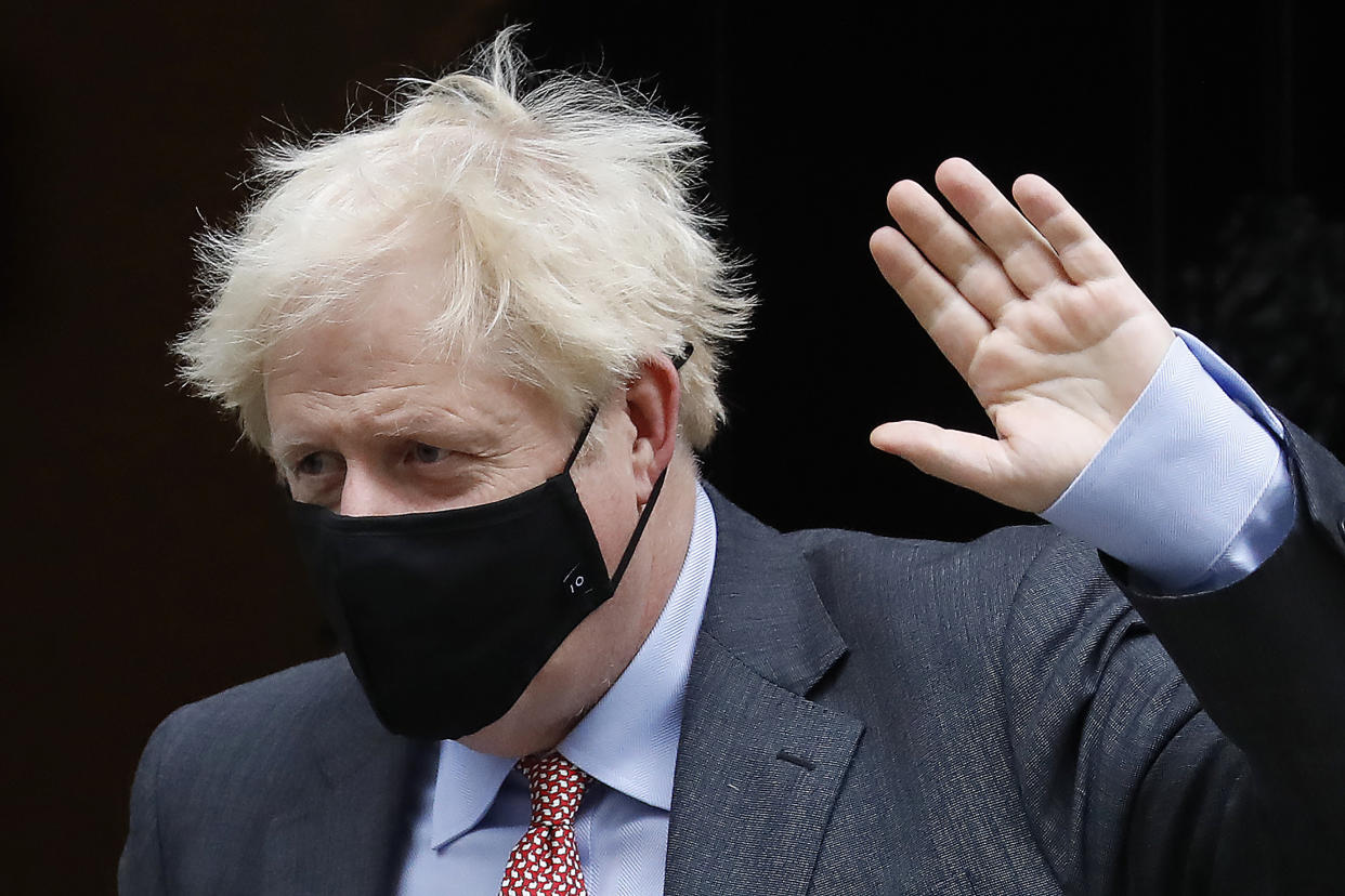 Britain's Prime Minister Boris Johnson wears a face mask or covering due to the COVID-19 pandemic, as he leaves 10 Downing Street in central London on September 30, 2020 to attend the weekly Prime Minister's Questions (PMQs) session in the House of Commons. (Photo by Tolga AKMEN / AFP) (Photo by TOLGA AKMEN/AFP via Getty Images)