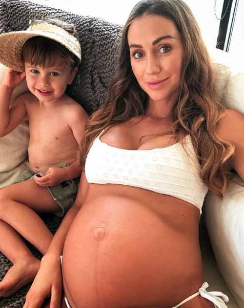 <p>She shared this tender snap of her blossoming bump. She poses with her gorgeous three-year-old Sonny.<br>Along with the photo, she shared some tips for other mothers facing stretch marks.<br>"have been obsessed with applying Pure/organic Rosehip oil to my tummy, hips and butt area ever since my first pregnancy with Sunny," she wrote.</p>