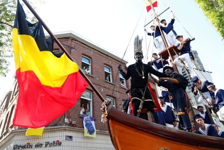 "The Savage", a white performer in a blackface disguise, parades during the festival Ducasse d'Ath in Ath