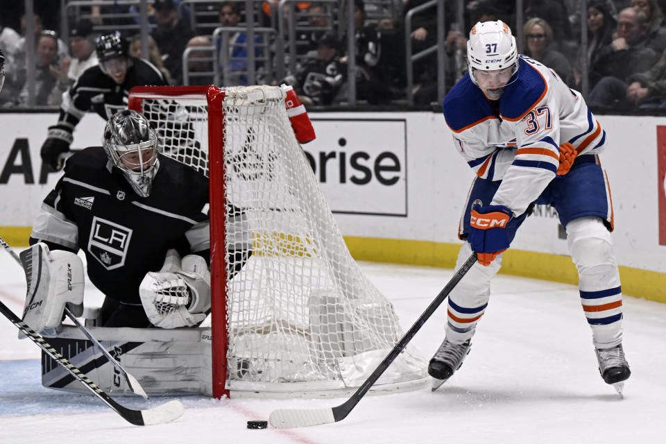 Edmonton Oilers left wing Warren Foegele (37) shoots against Los Angeles Kings goaltender David Rittich during the third period of an NHL hockey game in Los Angeles, Saturday, Feb. 10, 2024. (AP Photo/Alex Gallardo)