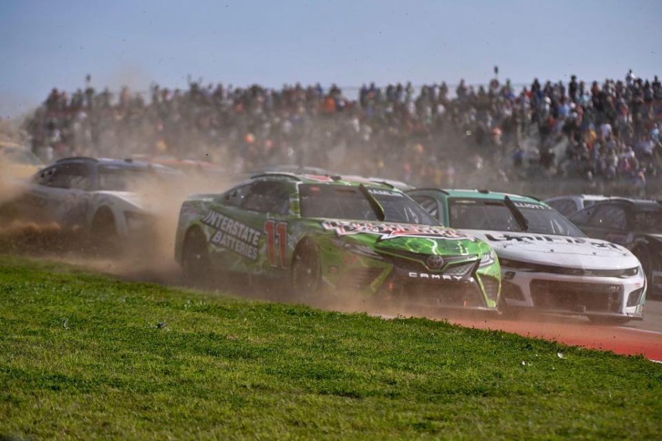 austin, texas march 26 denny hamlin, driver of the 11 interstate batteries toyota, and jordan taylor, driver of the 9 unifirst chevrolet, race during the nascar cup series echopark automotive grand prix at circuit of the americas on march 26, 2023 in austin, texas photo by logan rielygetty images