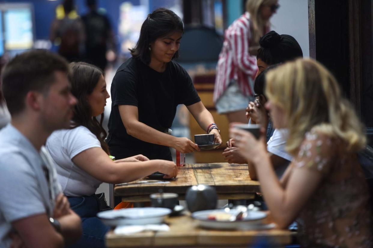 People dine outdoor at a restaurant in Brixton village on August 2, 2020 in London, England. British Prime Minister Boris Johnson has said it is time to "squeeze that brake pedal" on reopening the economy, amid rising fears that the UK is on the brink of a second wave: Getty Images