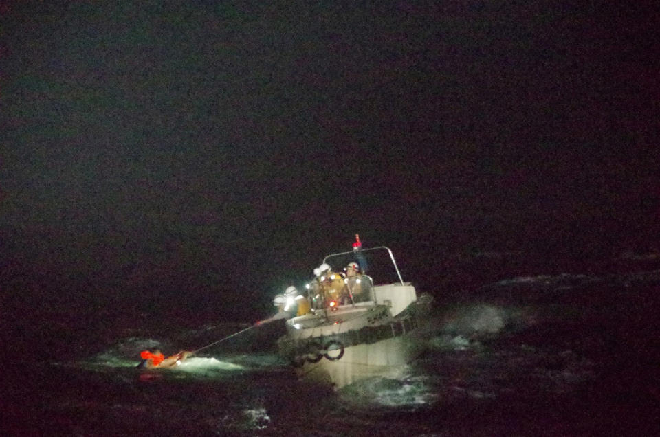 A Filipino crew member is rescued by the Japanese coast guard. Source: Reuters