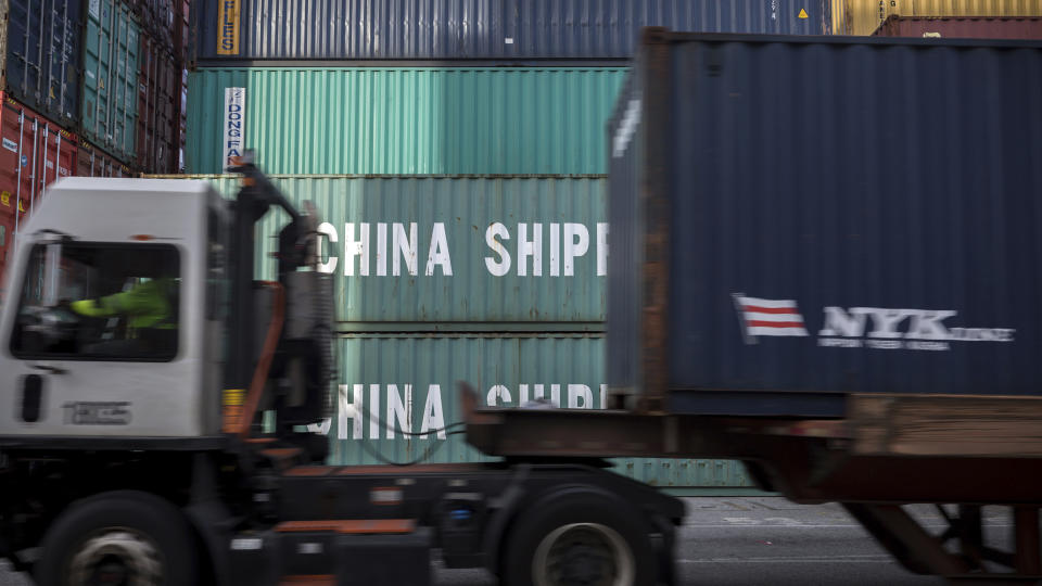 FILE - In this Thursday, July, 5, 2018 file photo, a jockey truck passes a stack of 40-foot China Shipping containers at the Port of Savannah in Savannah, Ga. Defying fears and predictions, the American job market is still shrugging off President Donald Trump’s trade wars. Employers added an impressive 266,000 jobs in November, and unemployment returned to a 50-year low 3.5% _ all at a time when the Trump administration is engaged in a bruising trade war with China while fighting other U.S. trading partners as well. (AP Photo/Stephen B. Morton)