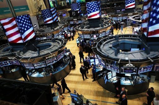 Traders work on the floor of the New York Stock Exchange during afternoon trading on July 31, 2013 in New York City. Wrapping up a two-day policy meeting, the Federal Open Market Committee (FOMC) said it would continue to buy $85 billion in bonds per month to help tamp down longer term interest rates that have been supporting the economy, and especially the housing market recovery