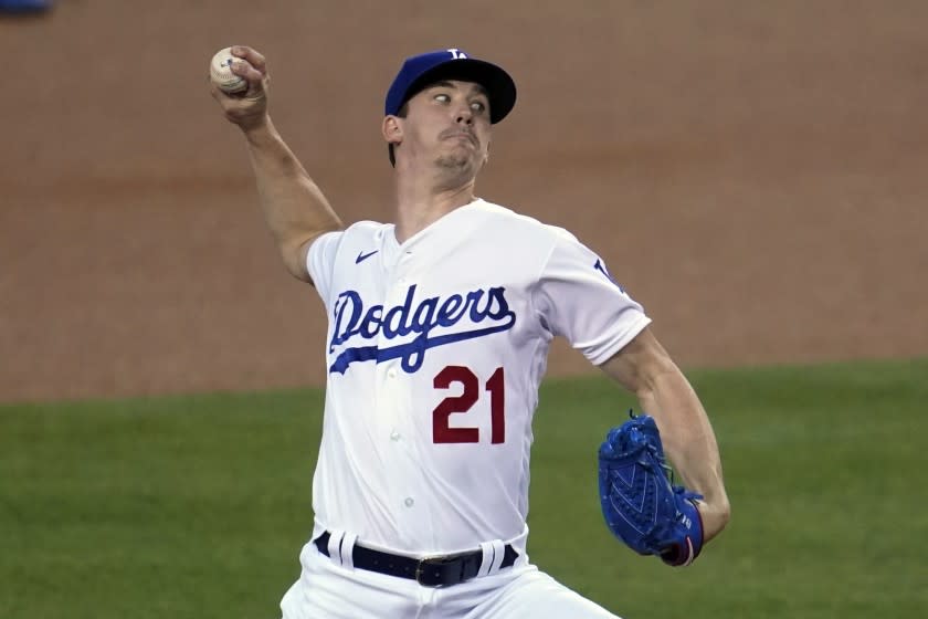 Los Angeles Dodgers starter Walker Buehler throws to an Oakland Athletics batter during the first inning.