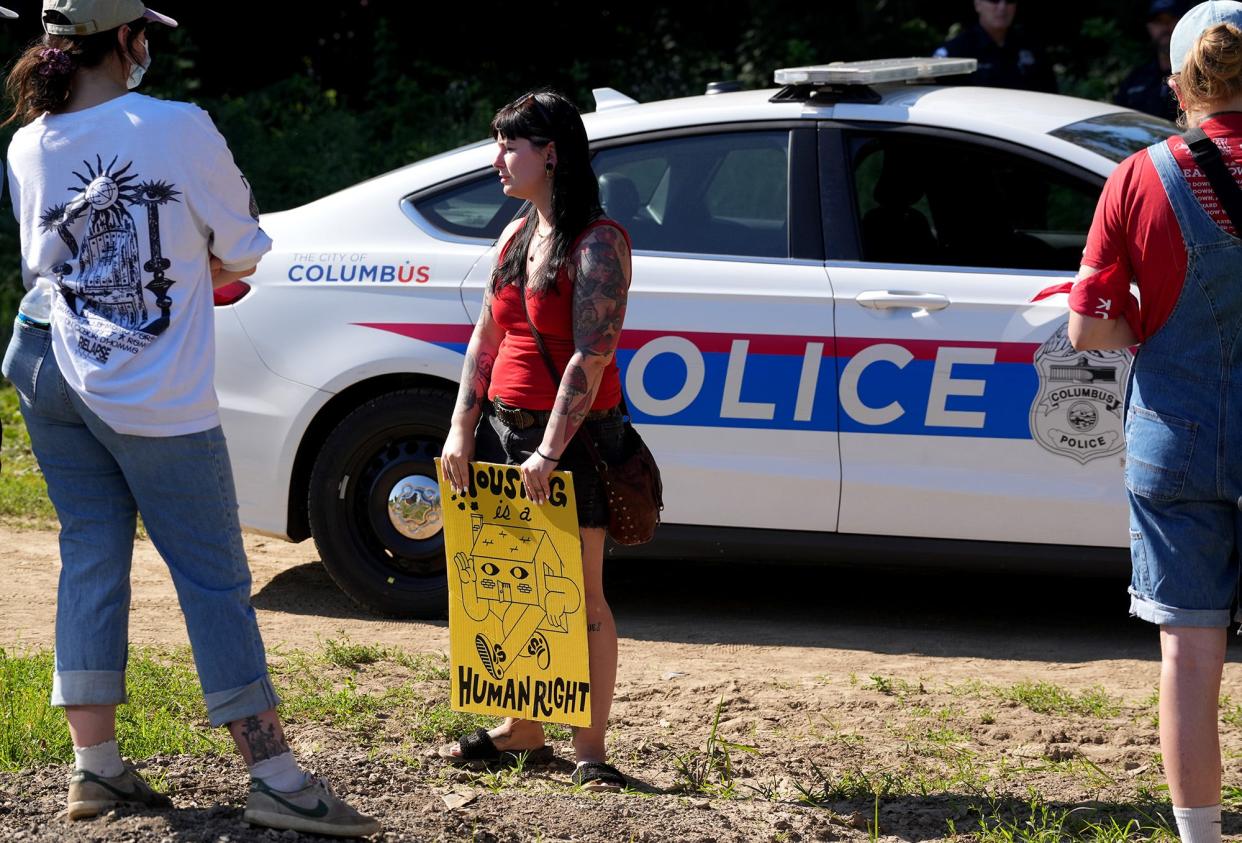 June 21, 2022; Columbus, Ohio; Homeless advocates protest  at the homeless camp adjacent to Heer Park as it is cleared up by the city on Tuesday, June 21, 2022. Fred Squillante- The Columbus Dispatch