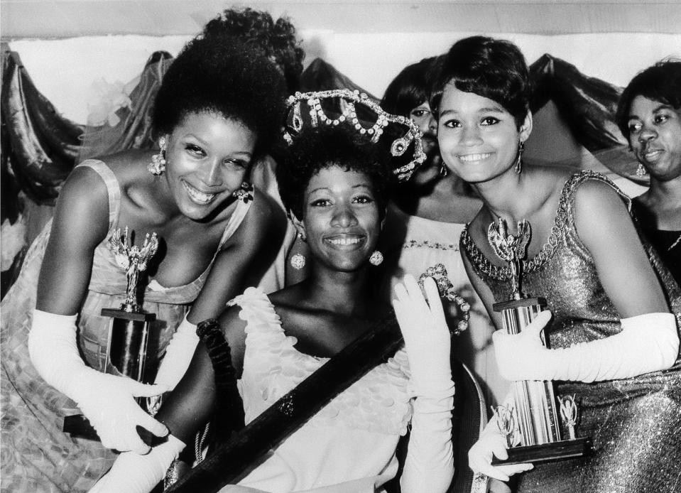 FILE - Saundra Williams, 19, center, of Philadelphia, is crowned the first Miss Black America at ceremonies in Atlantic City, N.J., flanked by first runner-up Theresa Claytor, 20, right, and second runner-up Linda Johnson, 21, left, Sept. 8, 1968. The contest was held to revolt against the lack of diversity in the Miss America competition, which is marking its 100th anniversary on Thursday, Dec. 16, 2021, having managed to maintain a controversial spot in American culture. (AP Photo/File)