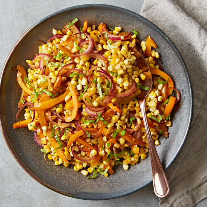 <p>We love fresh summer corn when it's in season, but frozen corn makes a great year-round substitute in this quick and easy side dish. <a href="https://www.eatingwell.com/recipe/263986/fresh-sweet-corn-salad/" rel="nofollow noopener" target="_blank" data-ylk="slk:View Recipe" class="link ">View Recipe</a></p>