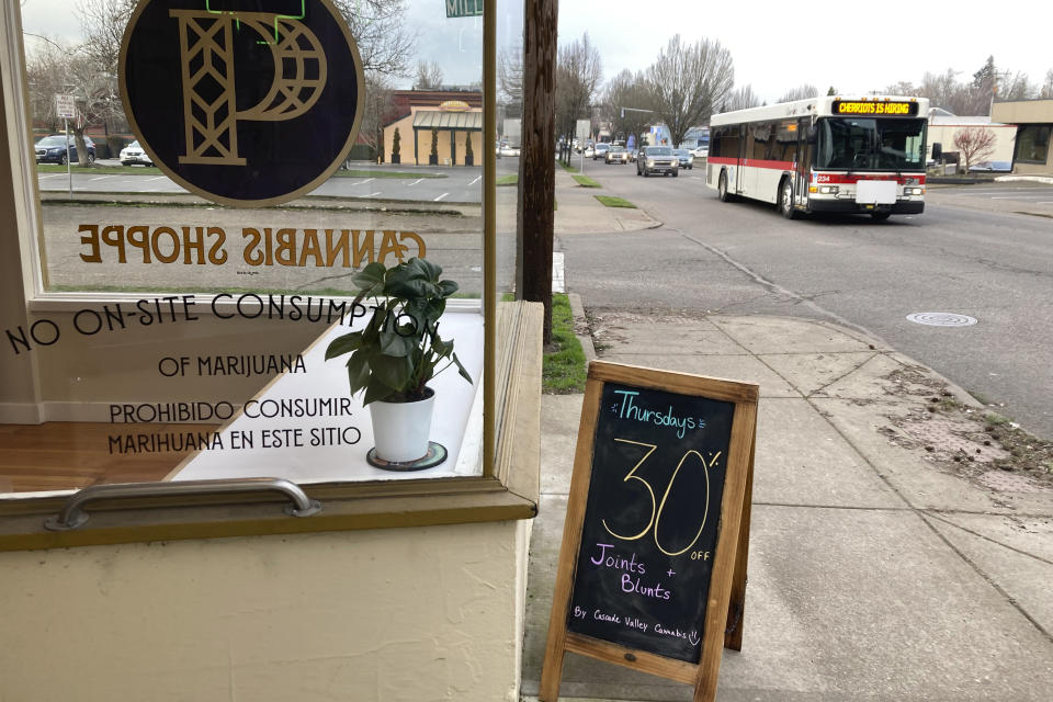 A 30% off on Thursdays sign is displayed outside Preserve Oregon, a marijuana shop in Salem, Ore., on Jan. 31, 2023. Along the West Coast, which has dominated U.S. marijuana production from long before legalization, producers are struggling with what many call the failed economics of legal pot...a challenge inherent in regulating a product that remains illegal under federal law. (AP Photo/Andrew Selsky)