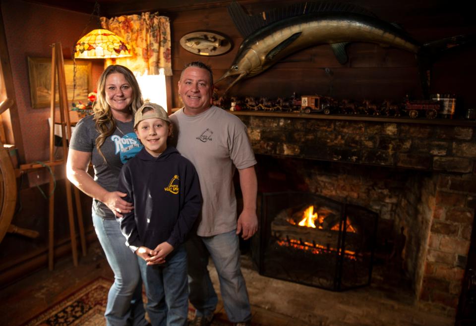 After being in business for 40 years, Ron's West End Pub in Long Branch closed Sunday, April 3. Randy and Suzanne Heinzman, shown with their 10-year-old son Niko, took over the establishment after Randy's father, Ron Heinzman, passed away in 2010.