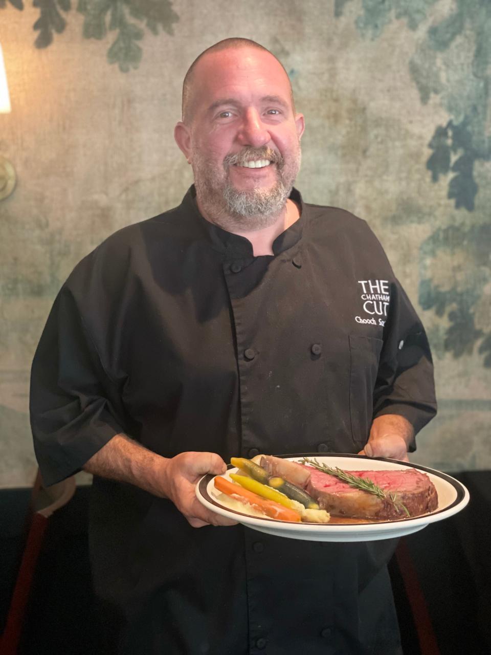 The Chatham Cut's kitchen manager Thomas LeBlanc with a plate of prime rib, one of the restaurant's most popular choices of the half-dozen steaks offered there.