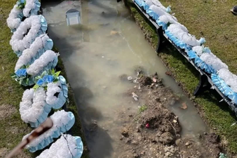 Ben's flooded grave when Rebecca visited on Mother's Day 2023