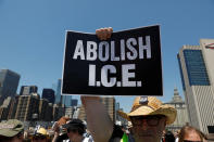 <p>A protest image is carried by a demonstrator as people cross the Brooklyn Bridge during “Keep Families Together” march to protest Trump administration’s immigration policy in New York, June 30, 2018. (Photo: Shannon Stapleton/Reuters) </p>