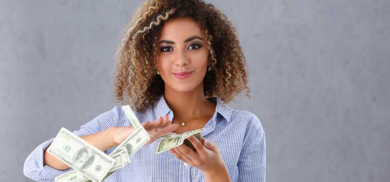 A woman seemingly throwing away cash